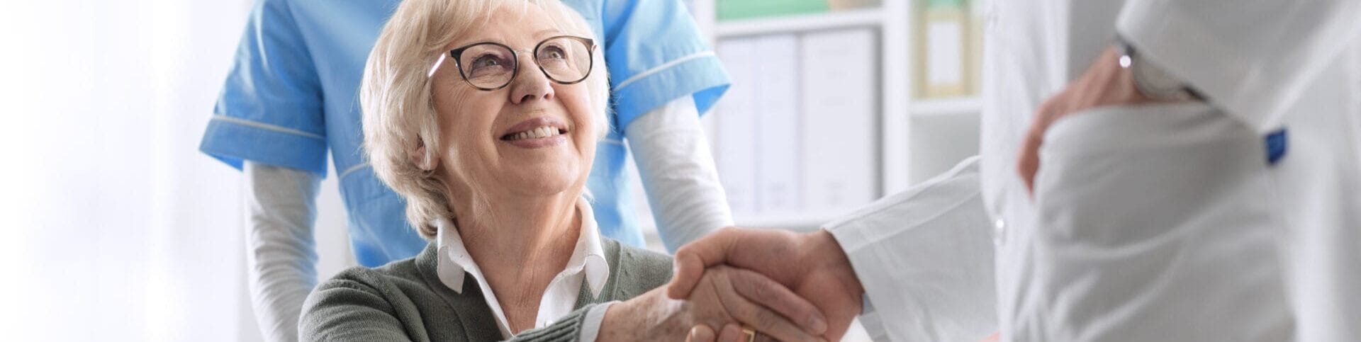 Doctor Giving An Handshake To A Senior Patient